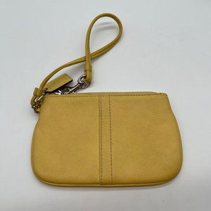 21. Coach Yellow Leather Zip Top Wristlet